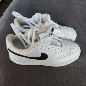 Nike White Athletic Shoes with Black Logo